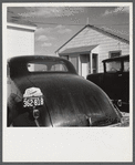 "Help Radford Blow The Hell Out Of Hitler" sign on the back of a defense worker's car in front of his home in Sunset Village, FSA (Farm Security Administration) project. Radford, Virginia.