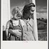 Mrs. Howard H. Smith and daughter from Galax by rural home built by FSA (Farm Security Administration) for defense workers near Radford, Virginia.