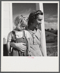 Mrs. Howard H. Smith and daughter from Galax by rural home built by FSA (Farm Security Administration) for defense workers near Radford, Virginia.