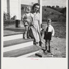 Riner, Virginia. Radford, Virginia (vicinity). Elsie Marie and Howard Jr., children of Mr. Howard H. Smith, with their mother on the porch of their new rural home, which was built for them by the FSA (Farm Security Administration) on JT Holley's property.