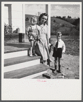 Riner, Virginia. Radford, Virginia (vicinity). Elsie Marie and Howard Jr., children of Mr. Howard H. Smith, with their mother on the porch of their new rural home, which was built for them by the FSA (Farm Security Administration) on JT Holley's property.