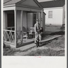 Fred B. Williams from Savannah, Georgia, a safety engineer at the powder plant, leaving his home at 803 9th Street. Sunset Village, Radford, Virginia. FSA (Farm Security Administration) project for defense workers.