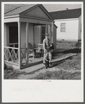 Fred B. Williams from Savannah, Georgia, a safety engineer at the powder plant, leaving his home at 803 9th Street. Sunset Village, Radford, Virginia. FSA (Farm Security Administration) project for defense workers.