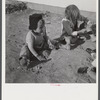 Children of defense workers playing outside their home in Sunset Village. FSA (Farm Security Administration) housing project. Radford, Virginia.