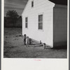 Children of defense workers playing outside their home in Sunset Village, FSA (Farm Security Administration) housing project. Radford, Virginia.