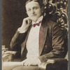 Tinted portrait photograph of magician Harry Rouclere