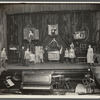 Thurston and company performing on stage, girl standing on chest in center stage