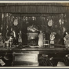 Thurston and company performing on stage: magic waters illusion