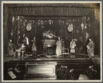 Thurston and company performing on stage: magic waters illusion