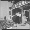 Unidentified woman outside hotel