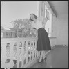 Unidentified woman on hotel balcony
