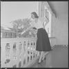 Unidentified woman on hotel balcony