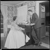 Unidentified people by a piano