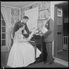Unidentified people by a piano