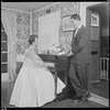 Unidentified people by a piano