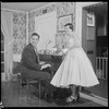 Unidentified people by a piano