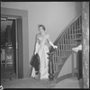 Unidentified woman in gown on staircase