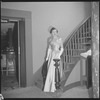 Unidentified woman in gown on staircase