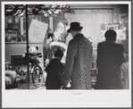 Window shoppers watching toy display in downtown Providence, Rhode Island