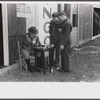 A variety of entertainment booths have sprung up just outside the Camp Stewart grounds near Hinesville, Georgia.