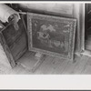 Belongings of a Negro farmer set out on the porch to be moved out of the Camp Croft army camp area. Near Spartanburg, South Carolina.