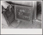 Belongings of a Negro farmer set out on the porch to be moved out of the Camp Croft army camp area. Near Spartanburg, South Carolina.