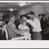 Sergeant from Fort Benning getting his son's hair cut at a barber shop in Columbus, Georgia.