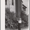 Judge Park pointing to the room in which he was born. The house is near the site of the old Parks Mill, Georgia.