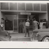 Workmen from a nearby powder plant at the post office in Childersburg, Alabama.
