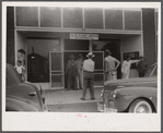 Workmen from a nearby powder plant at the post office in Childersburg, Alabama.