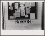Signs on the post office bulletin board in Childersburg, Alabama.
