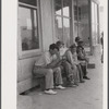 Workers, some of them unemployed, on the main street of Childersburg, Alabama.