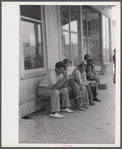 Workers, some of them unemployed, on the main street of Childersburg, Alabama.