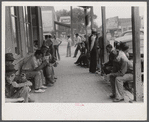Workers, some of them unemployed, on the main street of Childersburg, Alabama.