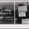 Real estate agent's window, Childersburg, Alabama.