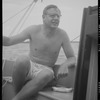 Unidentified person (Harvey?) on a boat