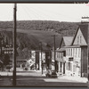 Street in the important anthracite town of Coaldale, Pennsylvania, showing huge coal bank in background.