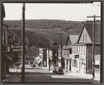 Street in the important anthracite town of Coaldale, Pennsylvania, showing huge coal bank in background.