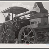 Tractor engine used to operate threshing machine at the farm of Alfred Shaffner, in submarginal farm area of Sugar Hill, near Townsend, New York.
