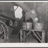 Threshing in the barn of Mr. Alfred Shaffner. A farmer in the submarginal farm area of Sugar Hill, near Townsend , New York.