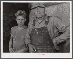 Mr. Thomas Templer and his son. A FSA (Farm Security Administration) client living in the submarginal area of Sugar Hill near Townsend, New York.