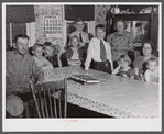 The Colson family, the children just back from school. Tobacco farmers near Suffield, Connecticut.