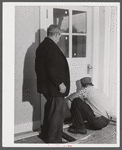 On a rainy day, Mr. Addison FSA (Farm Security Administration) client and his son are repairing the floor of their house near Middlefield, Connecticut.