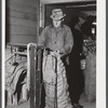 Weighing sacks of potatoes for shipment at the Woodman Potato Company. Caribou, Maine.