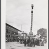 The "Pototem pole" standing in the main street of Presque Isle as an advertising stunt for the barrel rolling contest in Presque Isle, Maine.