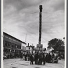 The "Pototem pole" standing in the main street of Presque Isle as an advertising stunt for the barrel rolling contest in Presque Isle, Maine.