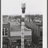 The "Pototem" pole standing in the main street of Presque Isle, Maine, as an advertisement for the barrel rolling contest.