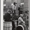 Younsters watching the men's race at the barrel rolling contest in Presque Isle, Maine.