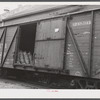 Sacks of seed potatoes loaded on a freight car of the Bangor and Aroostook Railroad for shipment. Caribou, Maine.