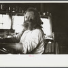 The Hermit of Maine playing his unique instrument, combination of two organs and a piano. Freeport, Maine.
